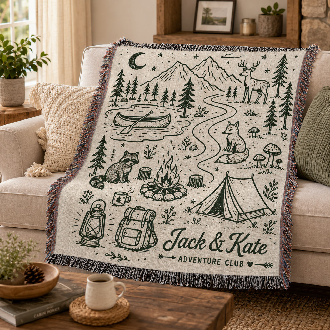 Personalized woodland camping woven blanket draped over a warm living room sofa