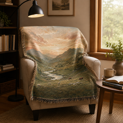 Alpine valley pasture woven blanket displayed on an armchair in a cozy reading nook