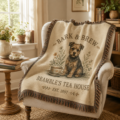 Dog tea house woven blanket draped over a cozy reading chair