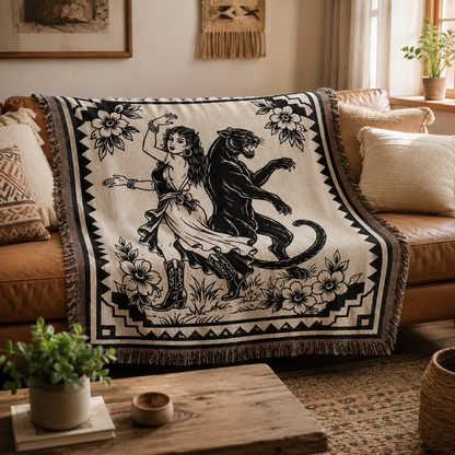 Black panther woven blanket styled on a tan leather sofa