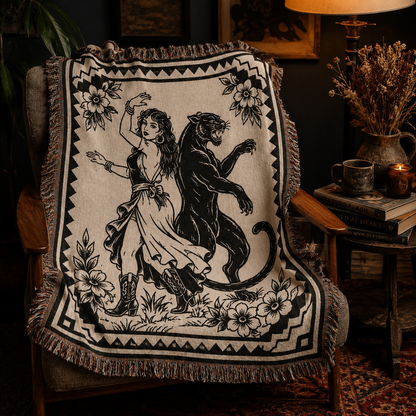 Black panther woven blanket displayed in a moody reading nook