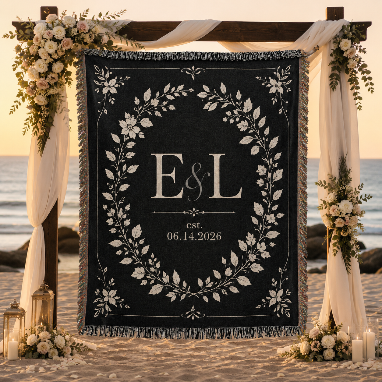 Personalized black wedding woven blanket displayed at a beach ceremony