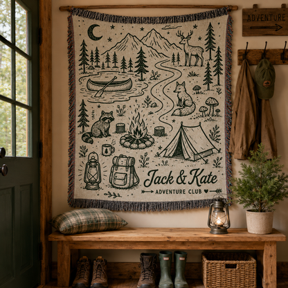 Personalized adventure woven blanket displayed as rustic cabin wall decor