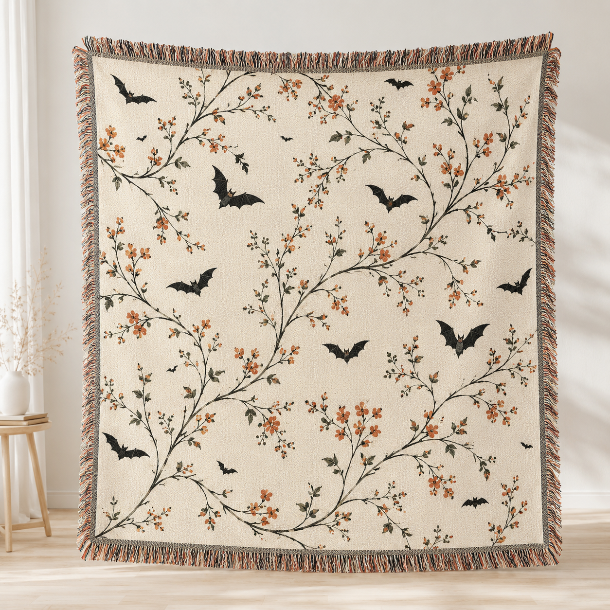 Botanical bat Halloween woven blanket with ivory background orange blossoms and fringe