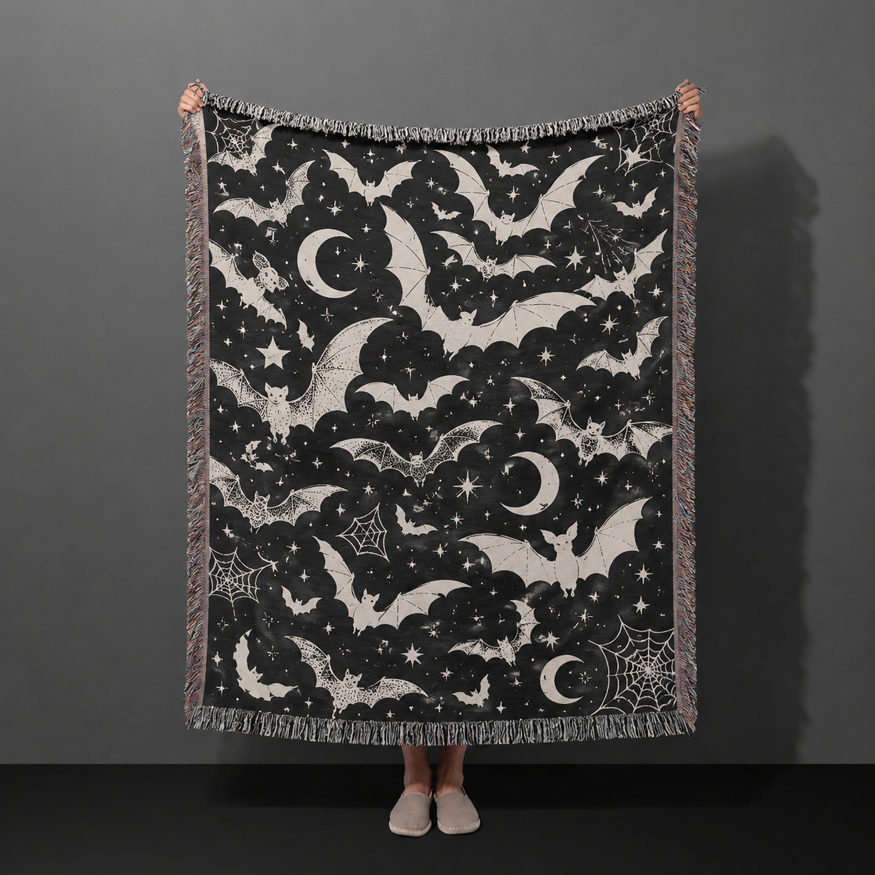 Black and ivory celestial bat Halloween woven throw blanket with moons stars and spiderwebs