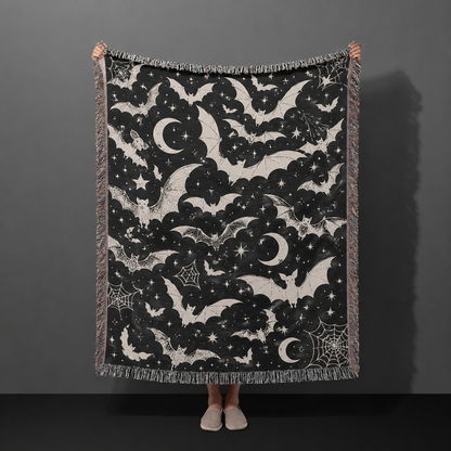 Black and ivory celestial bat Halloween woven throw blanket with moons stars and spiderwebs