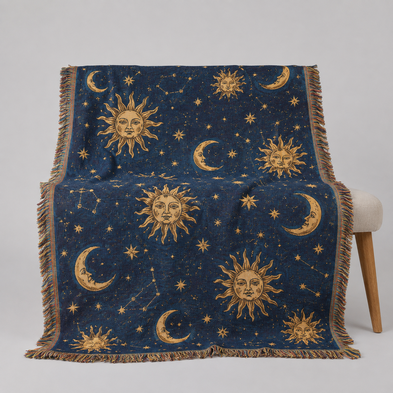 Vintage celestial sun and moon woven blanket with gold stars on deep navy blue