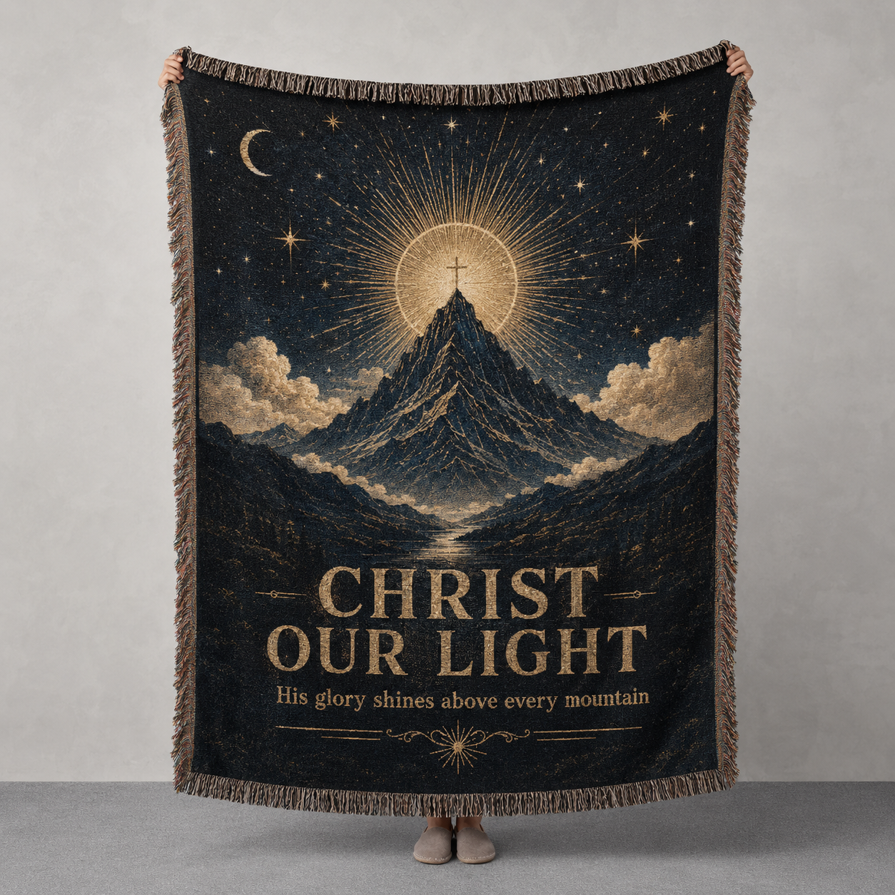 Christ Our Light woven blanket with mountain, radiant cross, stars and antique gold celestial design