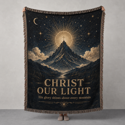 Christ Our Light woven blanket with mountain, radiant cross, stars and antique gold celestial design