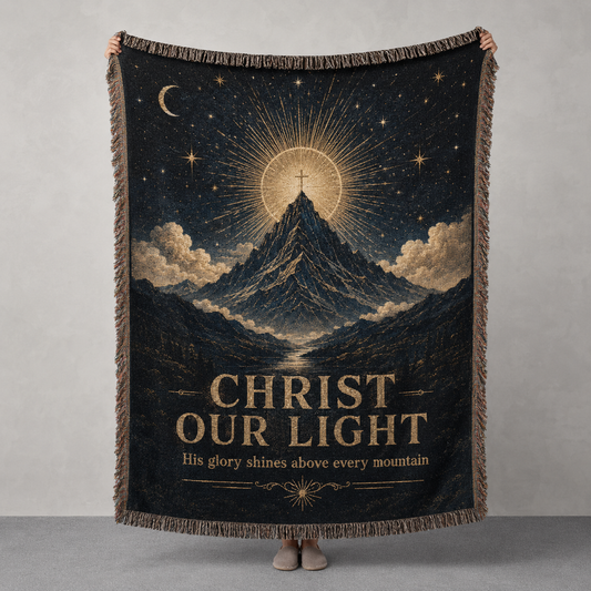 Christ Our Light woven blanket with mountain, radiant cross, stars and antique gold celestial design
