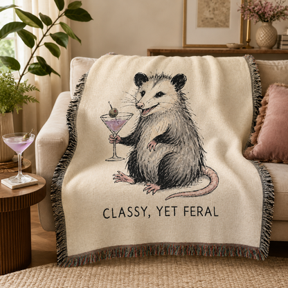 Classy Yet Feral opossum woven blanket styled on a living room sofa