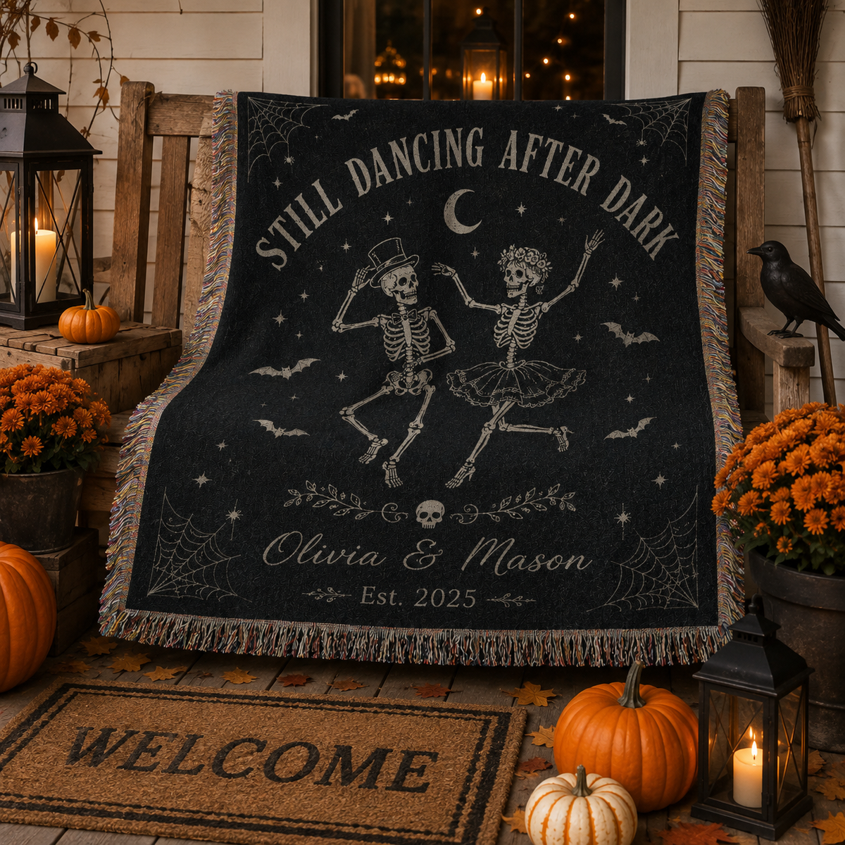 Custom names skeleton couple Halloween woven blanket displayed on an autumn porch