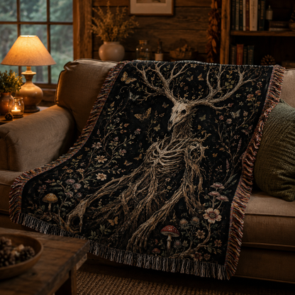 Gothic woodland deer skull woven blanket draped over a rustic cabin sofa