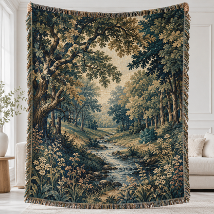 Enchanted forest stream woven blanket shown full front with teal woodland scene and fringe