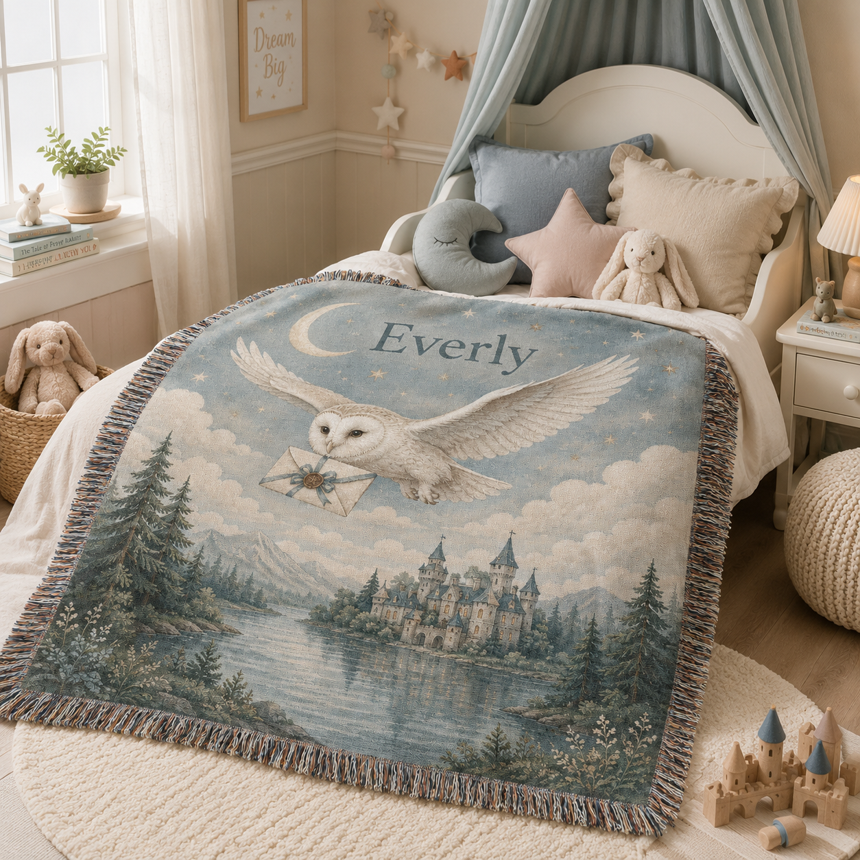Personalized enchanted owl woven blanket styled on a child's nursery bed