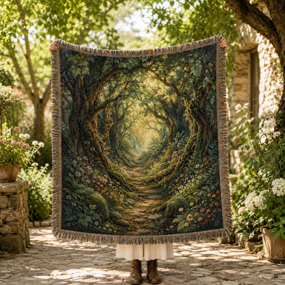 Woman holding an enchanted woodland path woven blanket outdoors in a sunlit garden