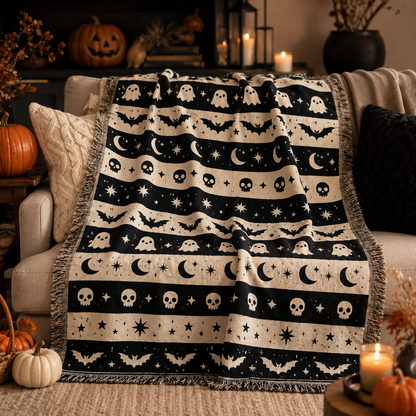 Ghost bat moon Halloween woven blanket styled on a cozy autumn sofa with pumpkins