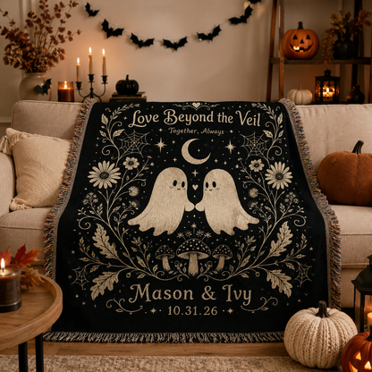 Ghost couple Halloween woven blanket displayed on a cozy sofa