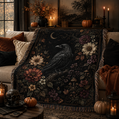 Gothic raven woven blanket styled on a cozy Halloween living room sofa