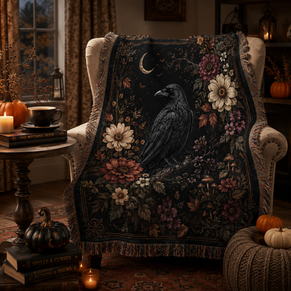 Gothic raven floral woven blanket displayed in a cozy Halloween reading nook