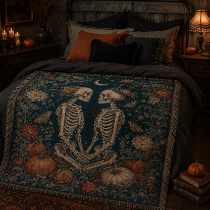 Gothic skeleton couple Halloween woven blanket displayed across a candlelit dark bedroom