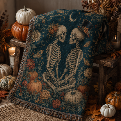 Close-up gothic skeleton couple woven blanket showing floral headpiece, top hat, crescent moon, moths and fringe