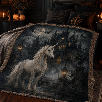 Gothic unicorn haunted castle woven blanket styled across a moody Halloween bedroom with soft folds and fringe