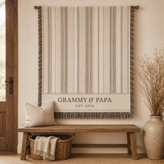 Personalized Grammy and Papa woven blanket displayed as farmhouse wall decor above a wooden bench