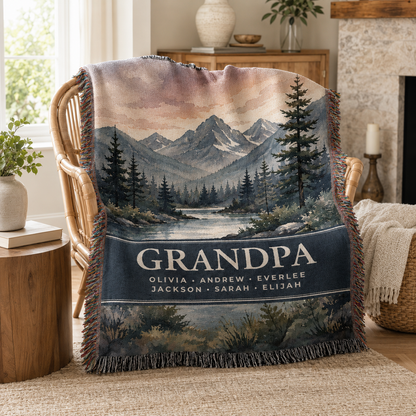 Personalized Grandpa mountain woven throw displayed on a cozy reading chair