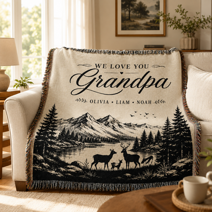 Personalized Grandpa mountain woven blanket on a cozy sofa