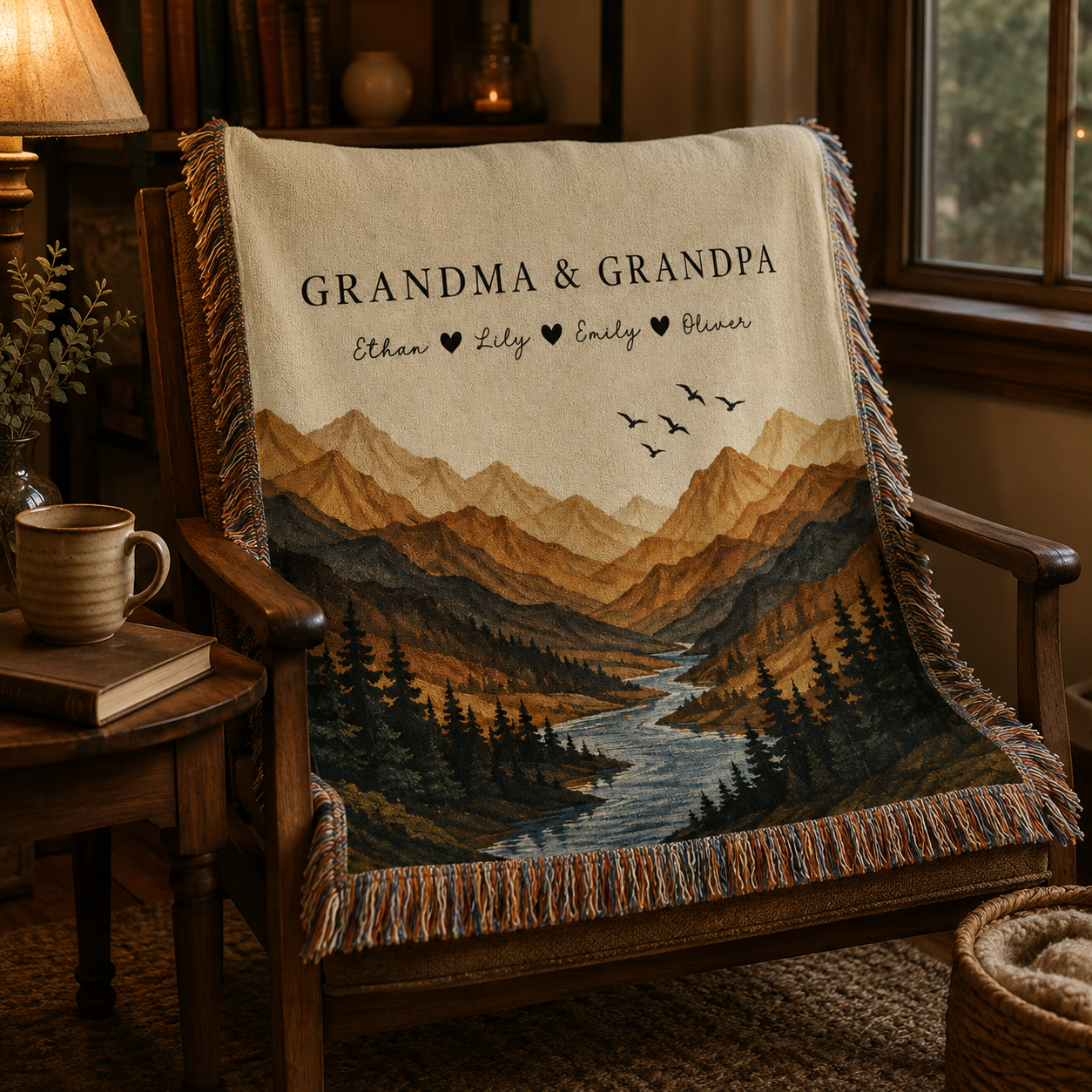 Personalized grandparents mountain woven blanket draped over a rustic reading chair