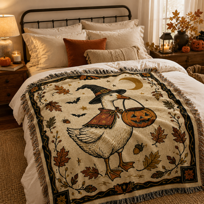 Halloween witch goose woven blanket styled on a cozy autumn bedroom bed