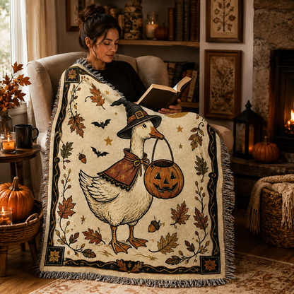 Reader wrapped in a soft Halloween witch goose woven blanket in a cozy reading nook