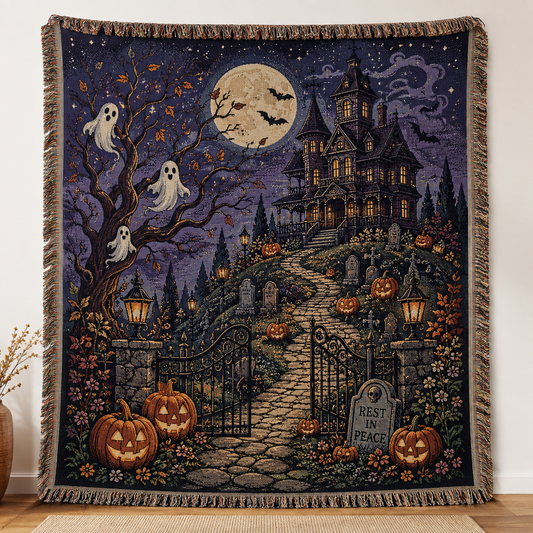 Haunted house Halloween woven blanket with ghosts, pumpkins, bats and fringe