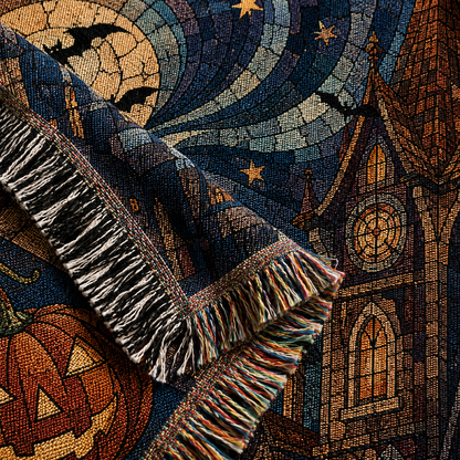 Macro woven texture and multicolor fringe of haunted village Halloween blanket