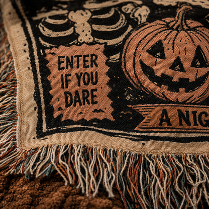 Macro close-up of Halloween woven blanket showing woven threads, textile texture and fringed edge