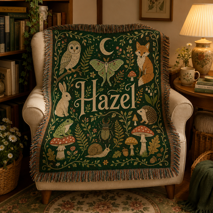 Personalized woodland name woven blanket displayed over an armchair in a cozy reading nook