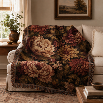 Dark floral tapestry throw styled across a cream sofa in a vintage-inspired living room