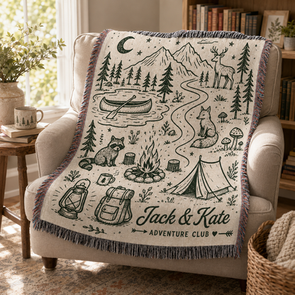 Personalized camping woven blanket draped over a cozy reading chair
