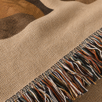 Macro close-up of woven yarn texture and multicolor fringe on Jesus blanket