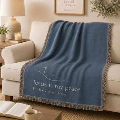Jesus is my peace woven blanket softly draped over a neutral sofa
