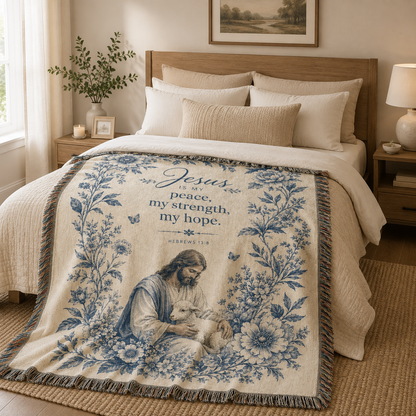 Jesus is my peace woven blanket styled across a cozy neutral bed