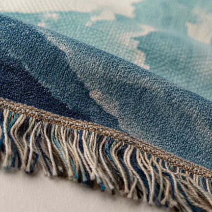 Macro close-up of woven yarn texture and multicolor fringe on blue Christian tapestry blanket