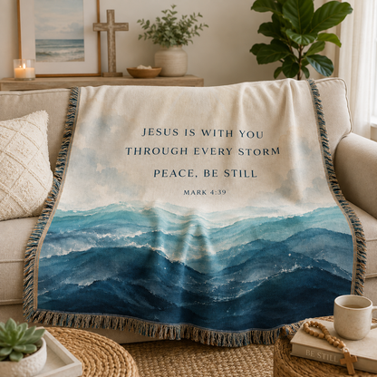 Christian Mark 4:39 woven blanket draped softly over a sofa with ocean wave design and fringe
