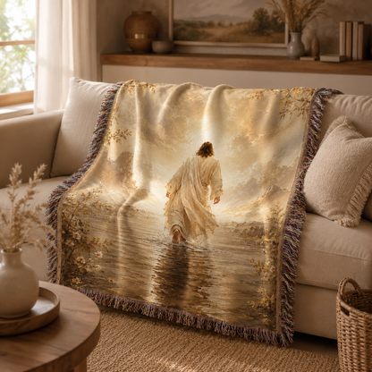Jesus walking toward light woven blanket softly draped over a neutral sofa