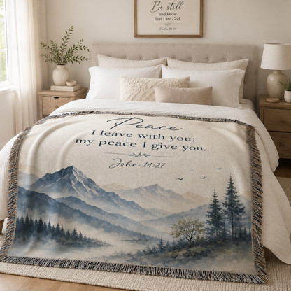 Peace I Leave With You John 14:27 woven blanket styled across a neutral bed