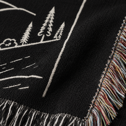 Macro close up of woven yarn texture and multicolor fringe on John 8:12 blanket