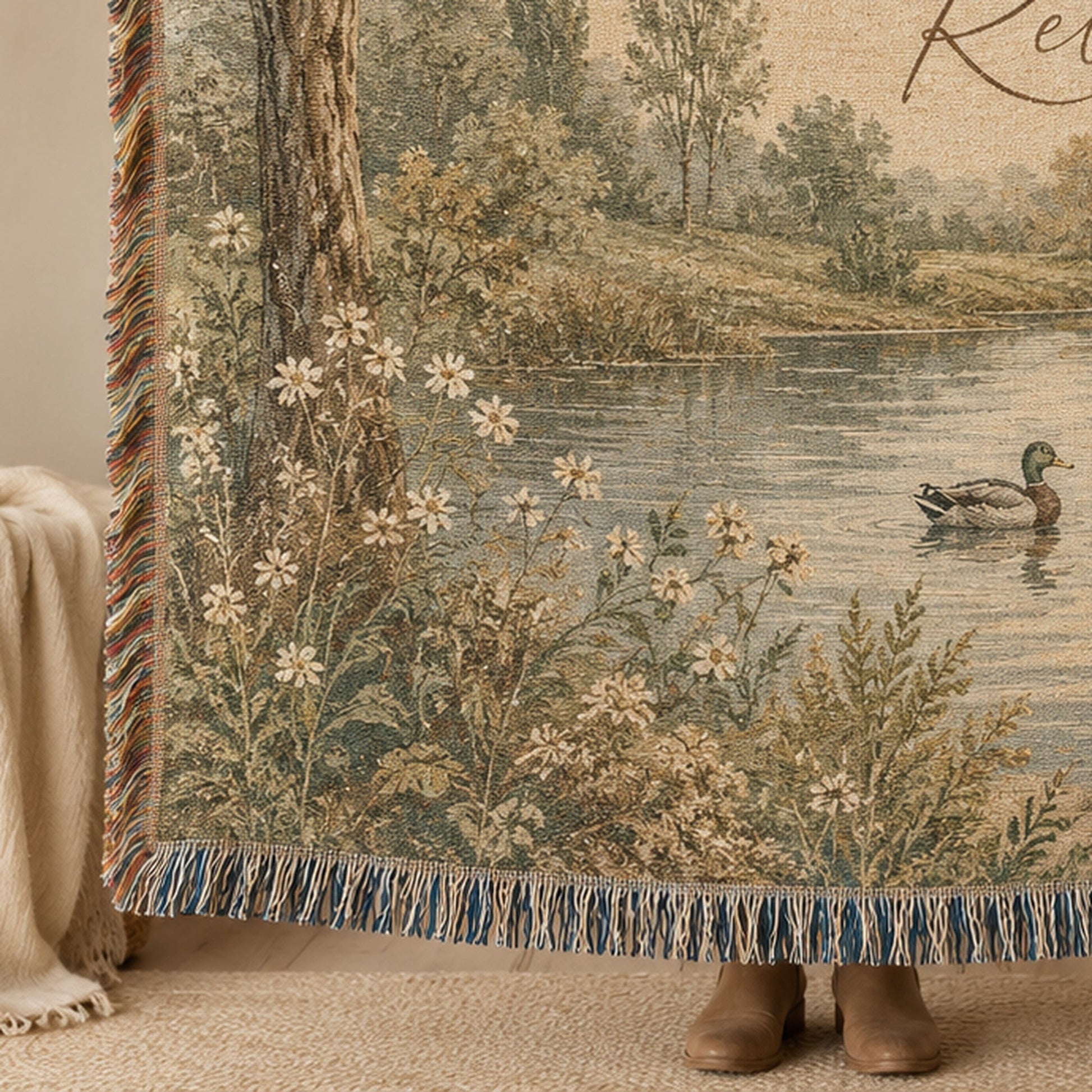 Close-up of woven texture, wildflower artwork and decorative fringe