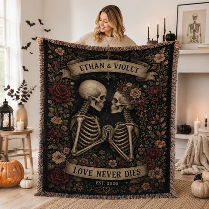 Woman displaying personalized Love Never Dies skeleton couple Halloween woven blanket