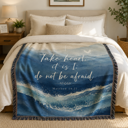 Matthew 14:27 Take Heart Christian woven blanket styled in a serene bedroom